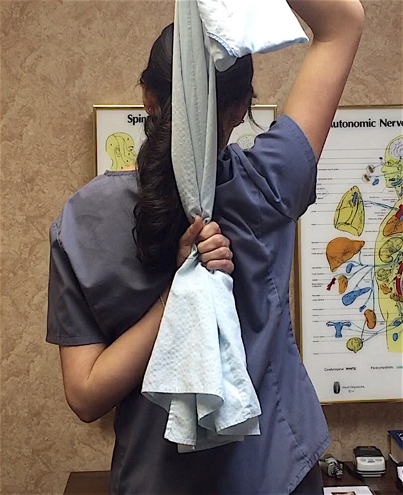 back-towel-stretch-for-your-upper-back-shoulders-by-upland-claremont-cucamonga-chiropractor